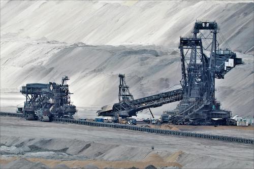 Heavy-duty mining equipment by Eusfur at a mining site, showcasing industrial machinery.